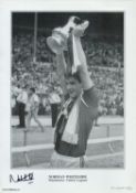 Norman Whiteside (Man Utd) signed 16.5 x 12 inch black and white print. Signed in black ink. Good