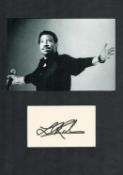 Lionel Richie signature piece mounted below black and white photo. Approx overall size 12x8inch.