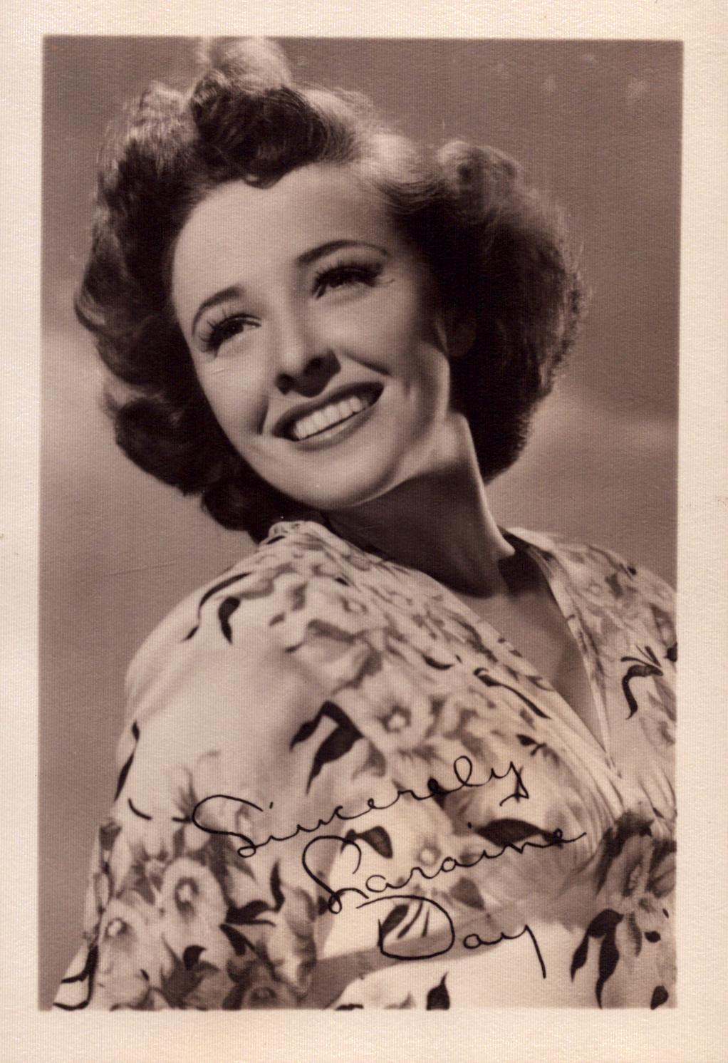Laraine Day signed 6x4 inch vintage black and white photo with original MGM mailing envelope. Good