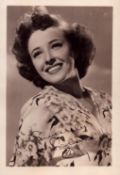 Laraine Day signed 6x4 inch vintage black and white photo with original MGM mailing envelope. Good