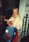 Dame Judi Dench signed colour photo, measures 6 inch by 9 inch. Good condition Est.