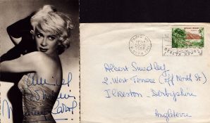 Martine Carol signed 5x3inch black and white photo with original mailing envelope. Good condition