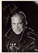 Oliver Reed signed 8x6 inch black and white photo. Dedicated. Good condition. All autographs come