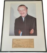 David Niven signed cheque dated 26/3/1962. Mounted and framed below colour photo. Approx overall