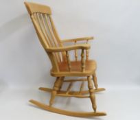 A beech rocking chair, approx. 1110mm high to back