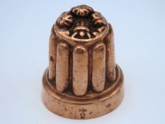 A Victorian copper mould with fleur de lys motif o