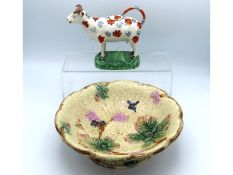 A 19thC. Staffordshire creamer, some restoration t