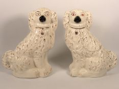 A pair of Victorian Staffordshire pottery spaniels