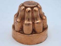An antique copper mould, 54mm tall