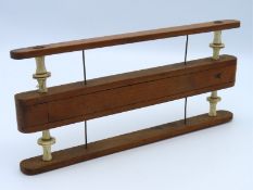 A 19thC. line winder for fishing with bone spindles, possibly French, 255mm wide