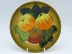 A Dennis China Works plate with fruit decor, 1999,