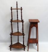 A decorative whatnot twinned with stained oak pot