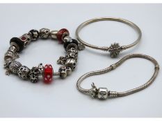 Three Pandora silver charm bracelets, 18 charms, 9