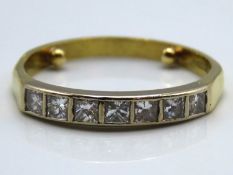 An 18ct gold half eternity ring set with seven pri