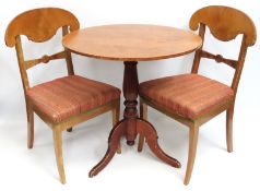 A 19thC. table with two chairs, possibly Swedish,