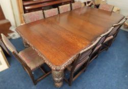 A large 19thC. extending oak dining table with heavily carved legs, 2390mm wide x 1290mm deep x 730m