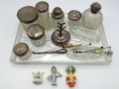 A dressing table tray with numerous silver topped