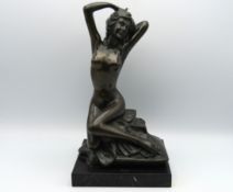 A decorative art deco style bronze of female nude