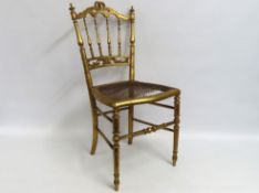 A 19thC. giltwood cane chair, cane a/f, 870mm high
