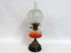 An oil lamp with etched shade, 594mm tall