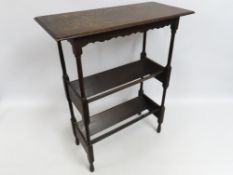 An Edwardian English oak book trough with top, 818