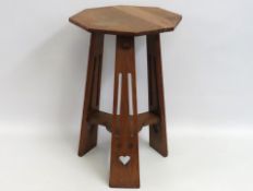 An early 20thC. arts & crafts oak lamp table retai