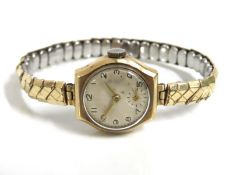 A 9ct gold cased ladies wrist watch with plated st
