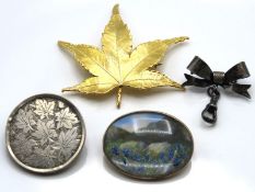 A continental silver gilt brooch with reverse pain