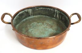 A 19thC. two handled copper pan, 495mm at widest