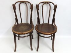 A pair of early 20thC. bentwood chairs with emboss