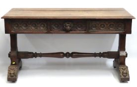 A 19thC. Gothic style oak library table featuring