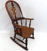 A Victorian elm rocking chair, 1090mm high to back