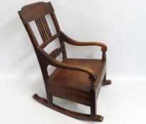 An oak mid 19thC. Scottish provincial rocking chair with drawer, 850mm high to back