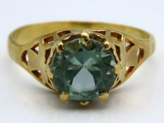 A yellow metal antique ring, tests electronically