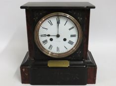 A Victorian slate mantle clock, bears presentation