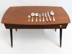 A retro teak swivel top canteen with six setting i