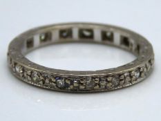 An 18ct white gold full eternity ring set with app
