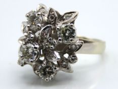 An 18ct white gold diamond cluster of organic form