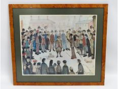 A framed Lowry print, 'The Street Trader', 680mm x