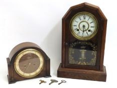 An oak cased New Haven Clock Company mantle clock,