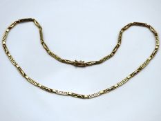 A 14ct gold 440mm long chain decorated with dolphi