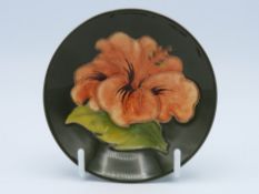 A Moorcroft pottery hibiscus pin dish, 92mm diamet