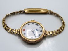 A ladies 9ct gold cased wrist watch with plated st