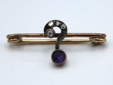 A yellow metal art nouveau period question mark br