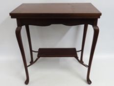 An Edwardian mahogany card table, with rectangular