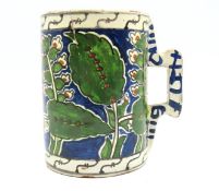 A 17thC. Iznik pottery tankard, faint 60mm curved