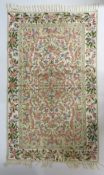 An embroidered rug, 1530mm x 920mm