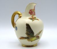 A Royal Worcester porcelain jug with gilding, bird
