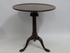 An 18thC. oak tripod tilt top table, 718mm high x