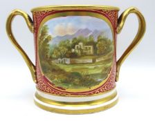 A 19thC. loving cup with hand painted landscape pa